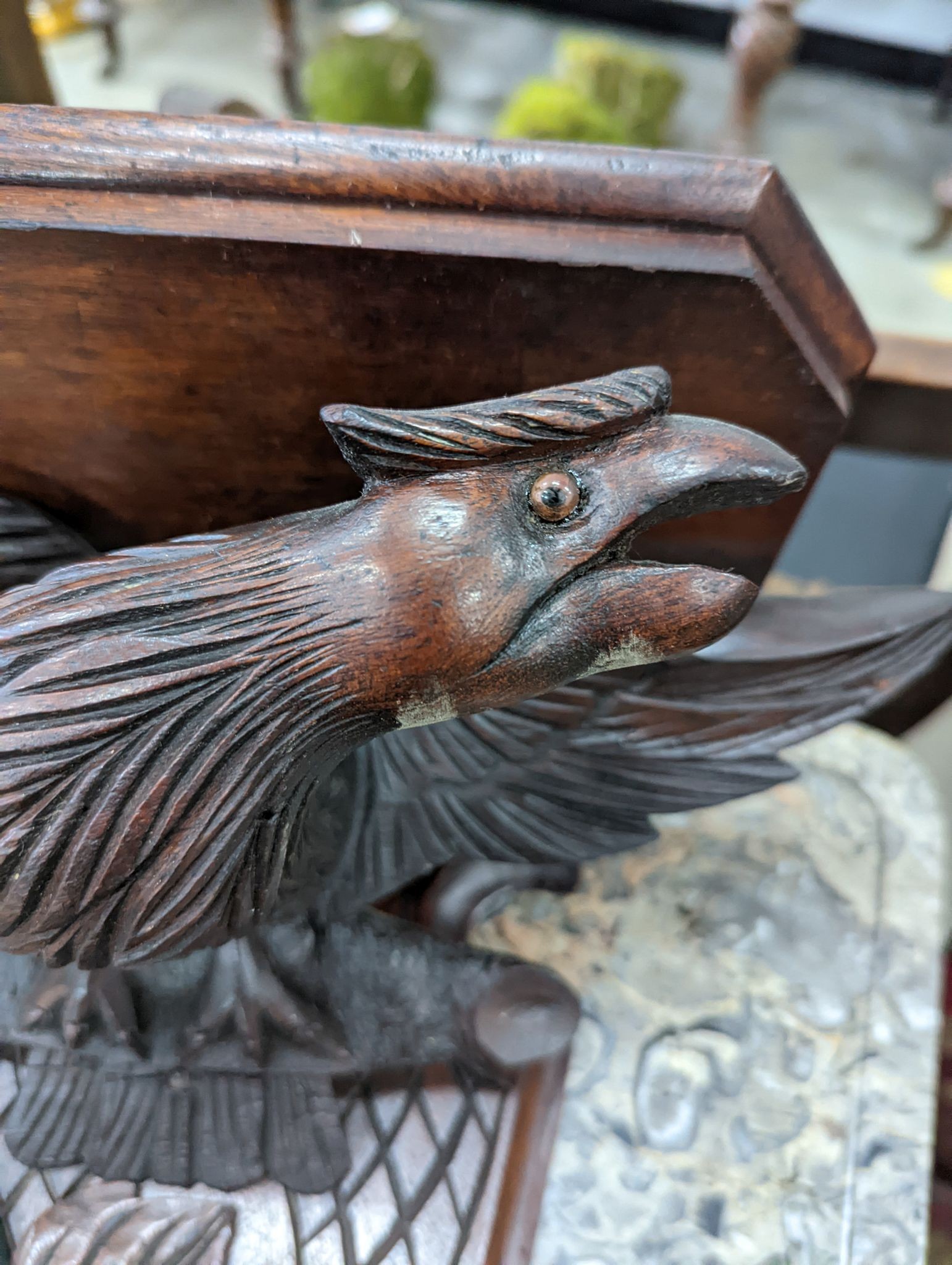 A Black Forest carved eagle wall bracket, width 34cm, height 30cm